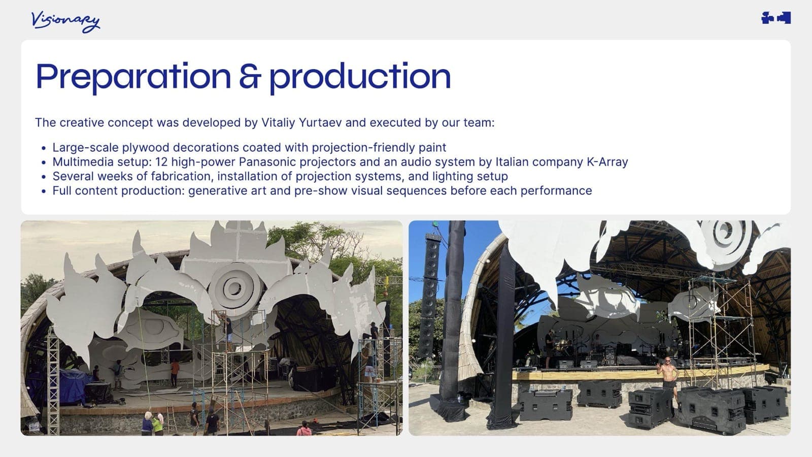 Production stage — large-scale plywood decorations, projector arrays, and audio system being staged.