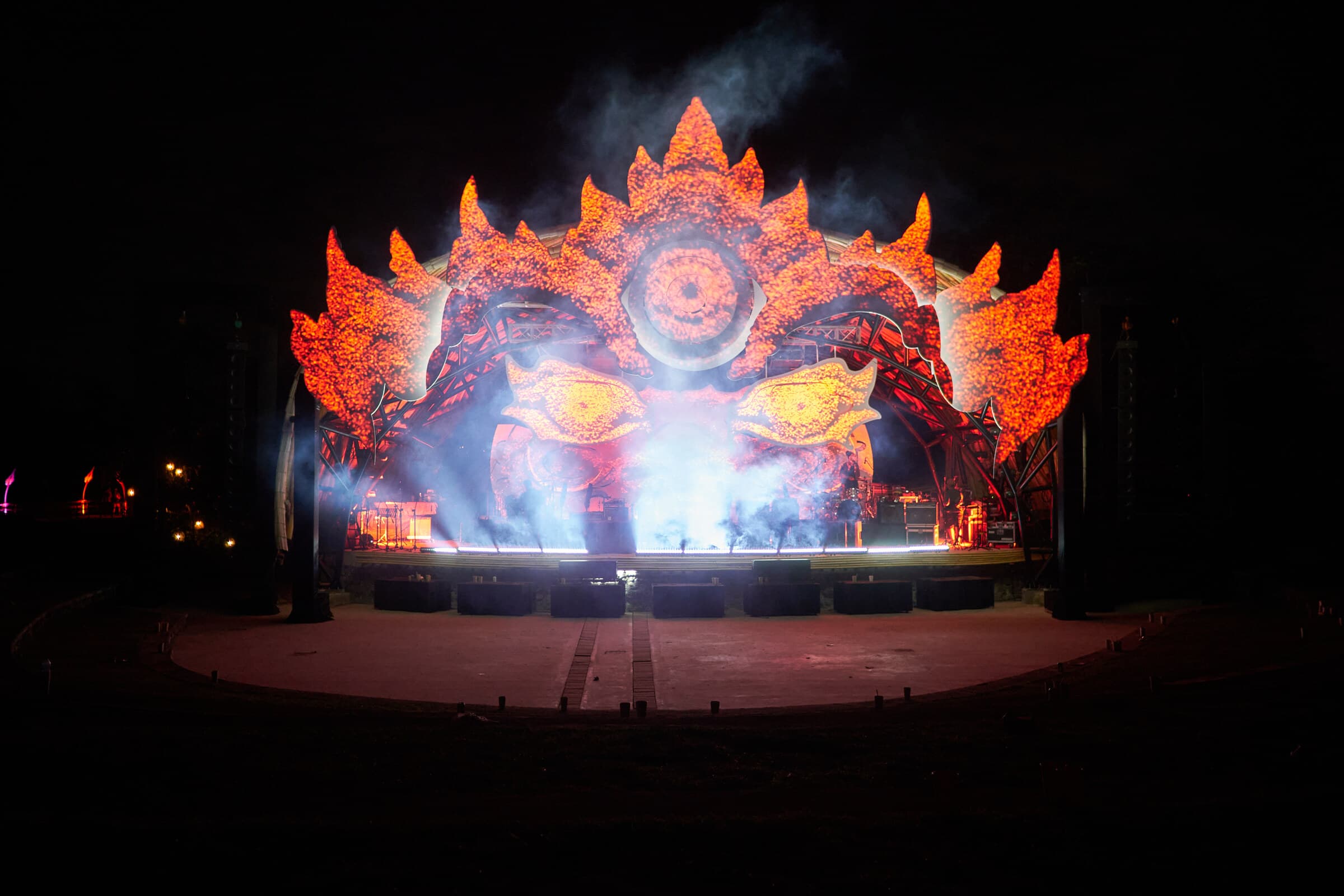 The complete Barong-inspired stage glowing orange through smoke